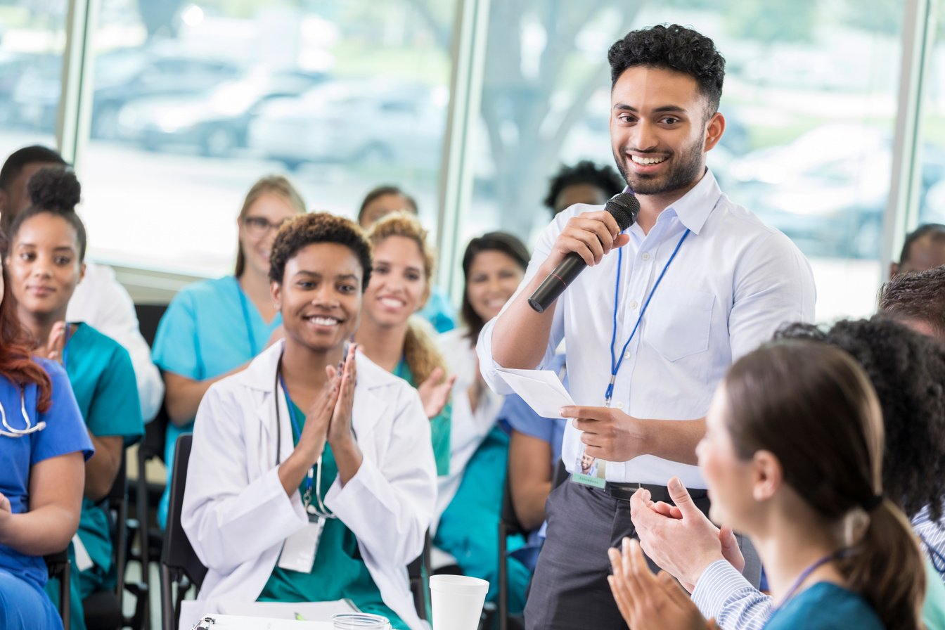 Confident healthcare professionals attend continuing education class